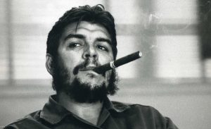 Che Guevara smoking a cigar.