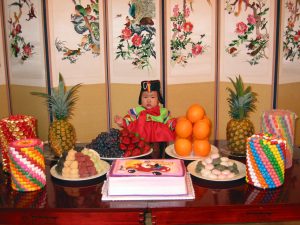 A Korean child celebrates his birthday using the Korean age-reckoning system.