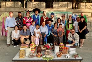 Tourists pose in traditional Korean clothing in Sariwon.