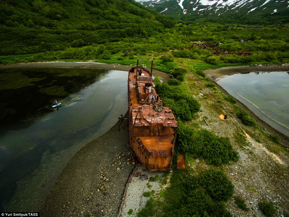 The rusting hulk of a ship sits grounded at Kamchatka.