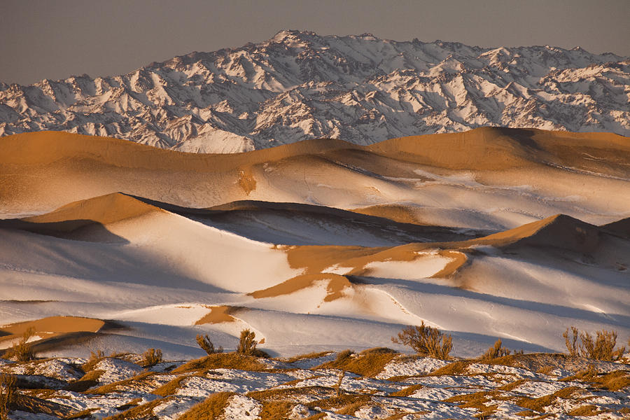 Frost sits on the dunes in the winter-time Gobi Desert.