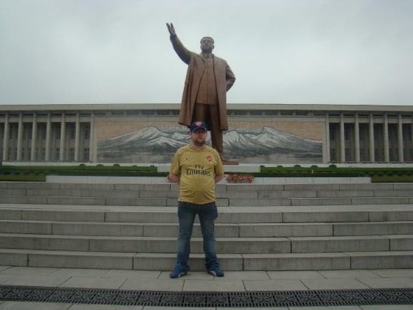 Gareth Johnson in front of the statue of Kim Il Sung on his first tour of North Korea